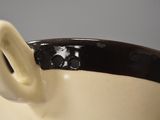 a close up of a coffee cup with a handle