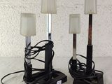 two lamps that are sitting on a table
