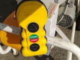 a yellow traffic light attached to the side of a boat