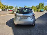 a silver car that is parked in a parking lot