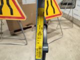 a measuring tape on the handle of a bicycle
