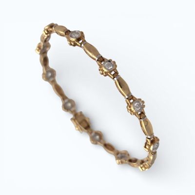 BRACELET en or jaune serti de 11 petits diamants Poids 11 g …