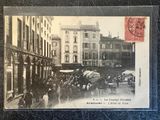 a postcard of a horse drawn carriage on a city street