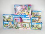 a lot of playmobils in the box on the table