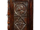 an old wooden cabinet with carvings on the front of it