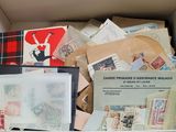 a box full of stamps and postcards in it