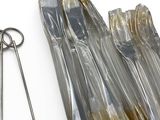 a pair of scissors and a pair of scissors on a white surface