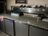 a picture of a restaurant counter with a bunch of dishes on it