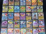 a close up of a bunch of pokemon cards on a table