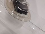 a plastic container with a piece of cake on top of it