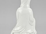 an image of a white statue of a woman sitting on top of a table