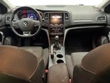 the interior of a car with a steering wheel, dashboard, and dashboard controls