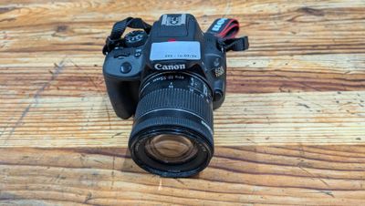 a camera that is sitting on a wooden table
