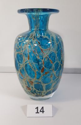 a glass vase with a blue and gold design on it