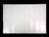 a close up of a white sheet of paper on a black background