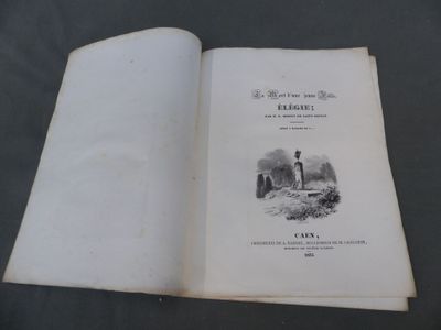 un livre ouvert sur lequel figure l'image d'un phare