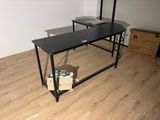 an image of a desk with a computer on top of it