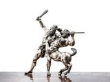 a statue of a man riding a horse with a sword