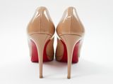 the back view of a pair of nude colored high heels