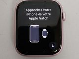 an apple watch with an approchez votre message on the screen
