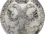 Gros plan sur une pièce de monnaie ornée d'un oiseau