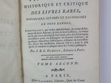 an open book with a black and white title on it
