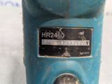 a close up of a blue machine with a label on it