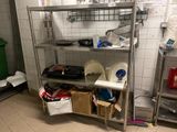 a metal shelving with many items on it in a kitchen