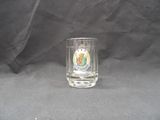 a shot of a shot glass with a picture of a man on it