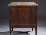 an old wooden cabinet with a marble top sits on a gray surface