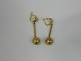 a pair of gold earrings on a white background