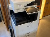 a photo of a stack of printer ' s in a room