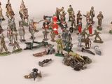 a lot of figurines that are sitting on a table