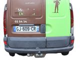 a brown and green van with a sticker on the back