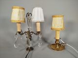 three lamps that are on a table with a lamp shade