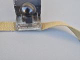 a close up of a belt with a metal ball on it