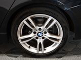 a close up of a bmw wheel on a black car