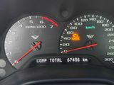 a close up of a speedometer on a car ' s dashboard