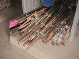 a pile of old baseball bats sitting on the ground