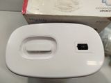 a white box and a white device on a table