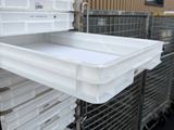 a cart that has many plastic trays on it