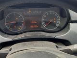 a car dashboard with a speedometer and a steering wheel
