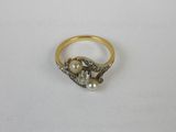 a close up of a gold ring with pearls on it
