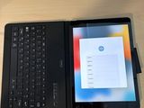 a tablet and a keyboard on a table