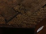 a close up of a wooden table with a piece of paper on it