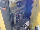 a machine that is sitting inside of a yellow cabinet