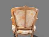 a chair that is sitting on a gray surface
