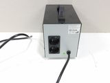 a black and white photo of a power supply on a white surface