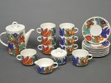 a lot of cups and saucers that are on the table