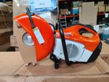 an orange and black portable air compressor sitting on top of a cardboard box